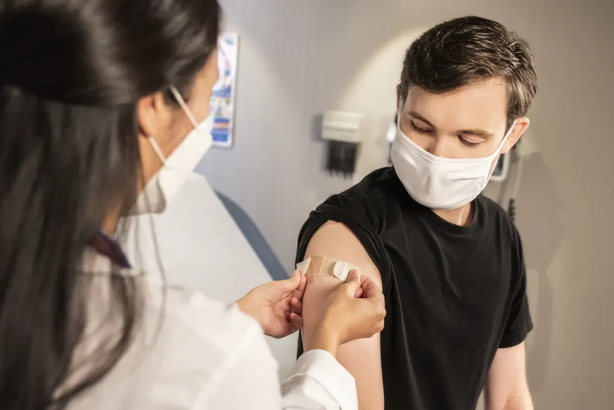 Nurse preparing a patient for a blood draw